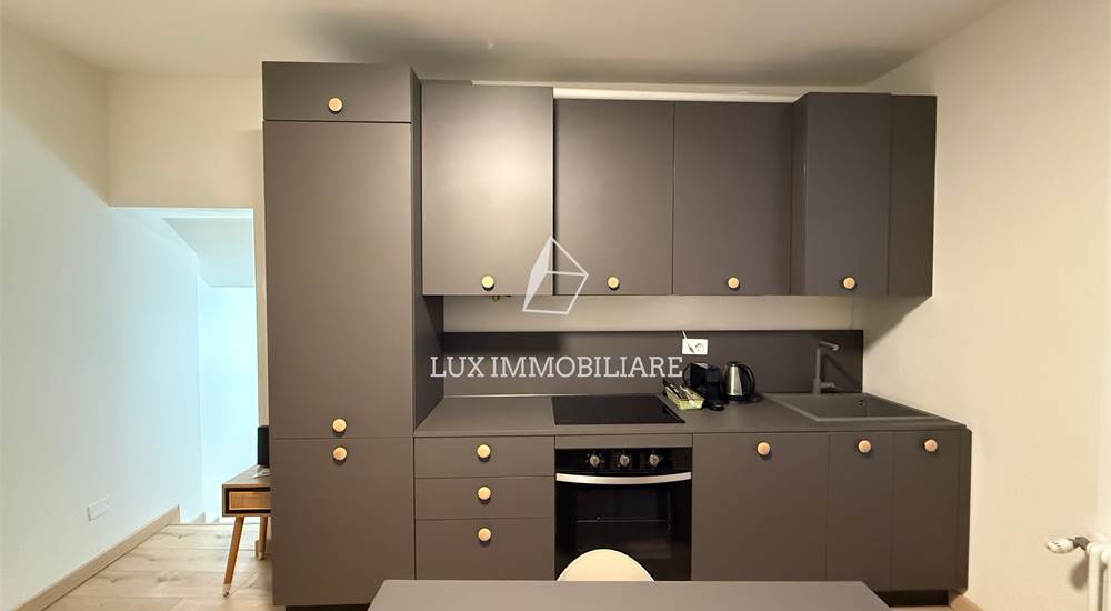 Soggiorno con cucina a vista